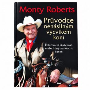 Přední deska knihy Průvodce nenásilným výcvikem koní od Montyho Robertse s fotografií autora u koně.